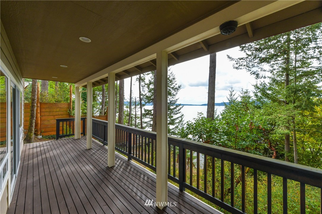 18184 Capet Zalsiluce Road La Conner, WA 98257 - Photo 6 of 25 a view of a porch with wooden floor