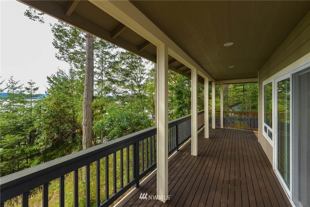 18184 Capet Zalsiluce Road La Conner, WA 98257 - Photo 7 of 25 a view of a balcony with wooden floor