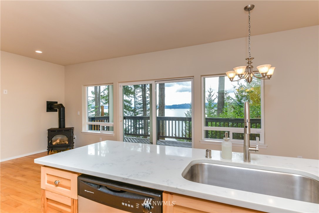 18184 Capet Zalsiluce Road La Conner, WA 98257 - Photo 9 of 25 a kitchen with a sink and a large window