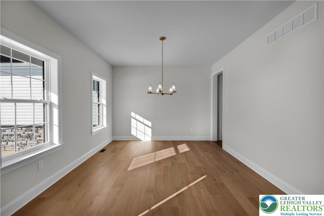1480 Bushkill Center Road Nazareth, PA 18064 - Photo 13 of 55 a view of a room with window wooden floor and a ceiling fan