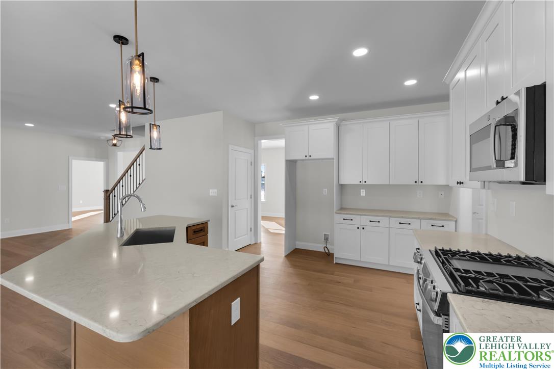 1480 Bushkill Center Road Nazareth, PA 18064 - Photo 18 of 55 a kitchen that has a lot of cabinets in it and wooden floor