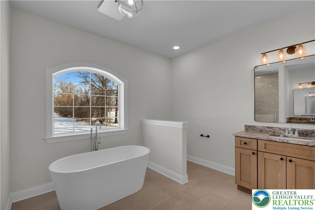 1480 Bushkill Center Road Nazareth, PA 18064 - Photo 30 of 55 a bathroom with a sink and a mirror