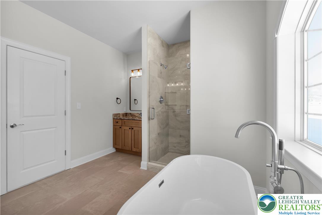 1480 Bushkill Center Road Nazareth, PA 18064 - Photo 31 of 55 a bathroom with a sink a toilet and shower