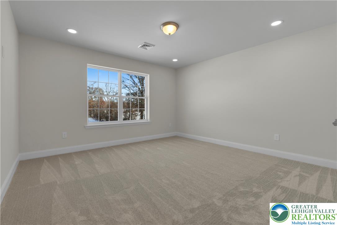 1480 Bushkill Center Road Nazareth, PA 18064 - Photo 38 of 55 an empty room with windows and entrance