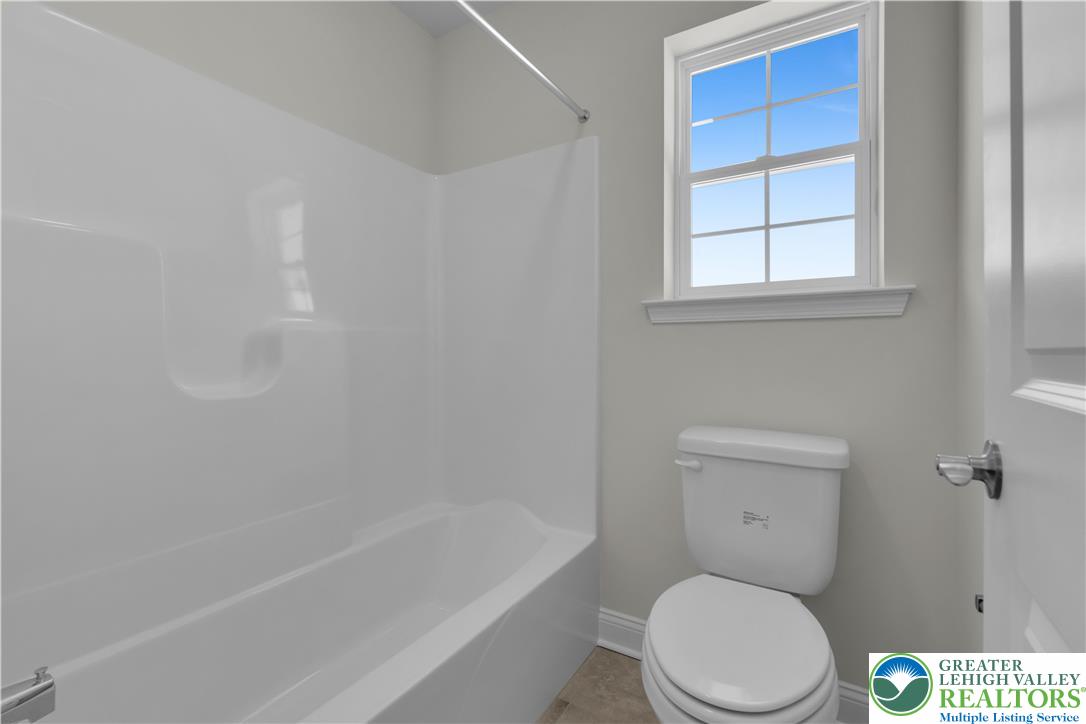 1480 Bushkill Center Road Nazareth, PA 18064 - Photo 42 of 55 a white toilet sitting next to a bath tub