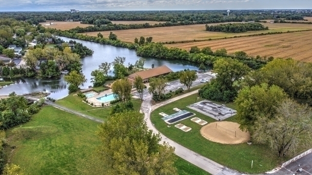 64 Fossil Ridge Road Wilmington, IL 60481 - Photo 35 of 40 an aerial view of lake residential house with swimming pool and mountain view