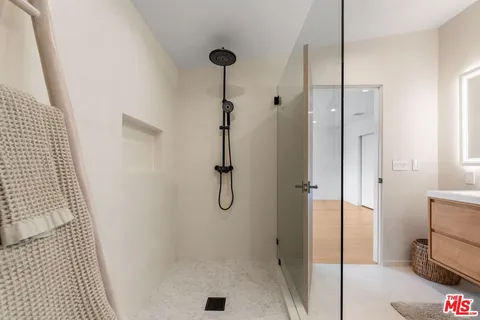 a bathroom with a sink and shower