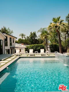 a view of a house with swimming pool