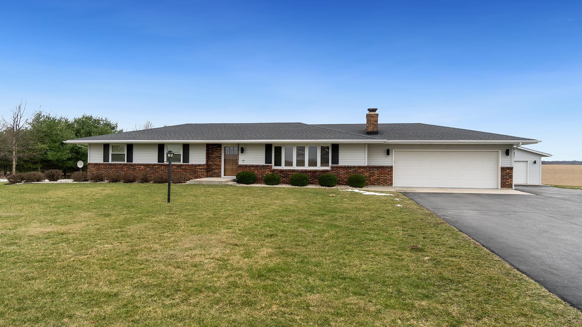 11764 North Tower Road Byron, IL 61010 - Photo 1 of 38 a front view of a house with a yard