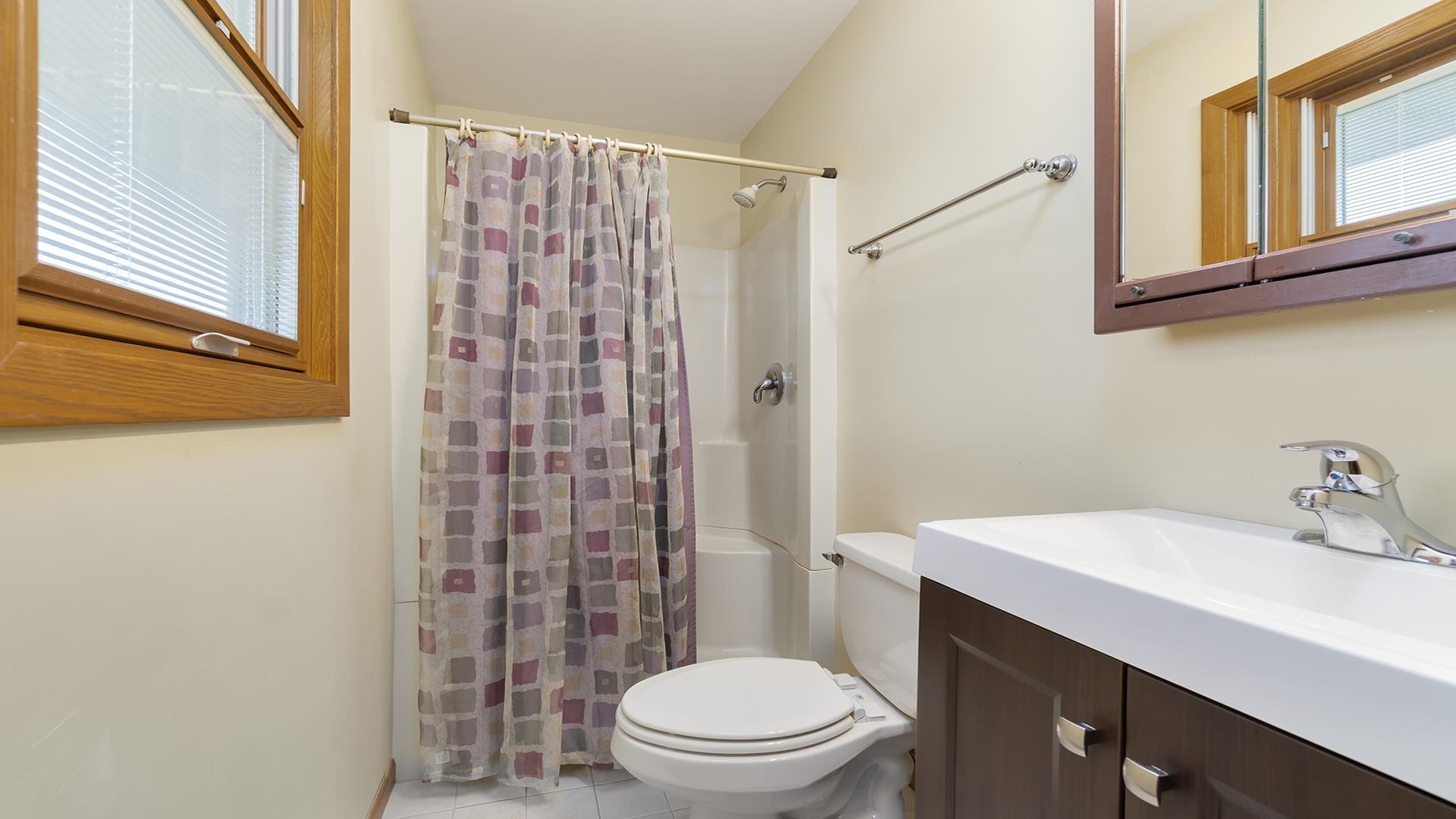 11764 North Tower Road Byron, IL 61010 - Photo 15 of 38 a bathroom with a sink a toilet and shower