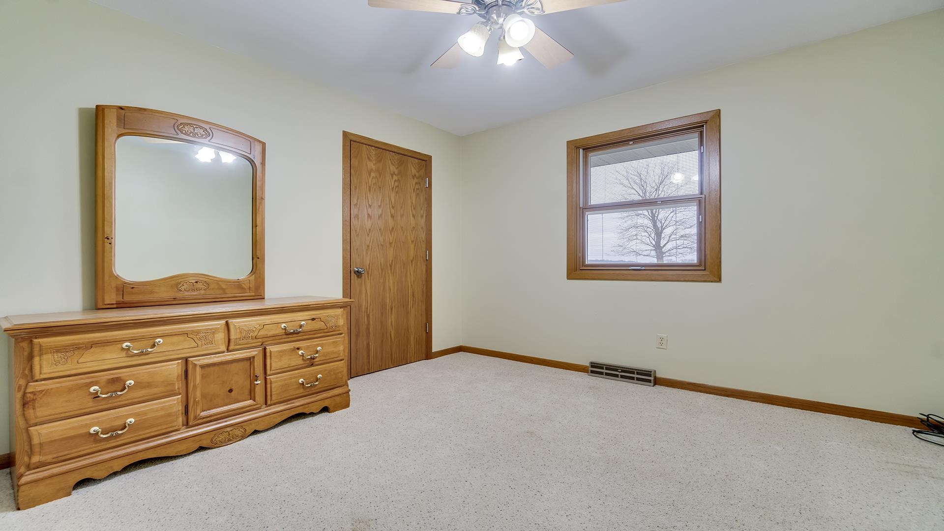 11764 North Tower Road Byron, IL 61010 - Photo 16 of 38 an empty room with windows and cabinet