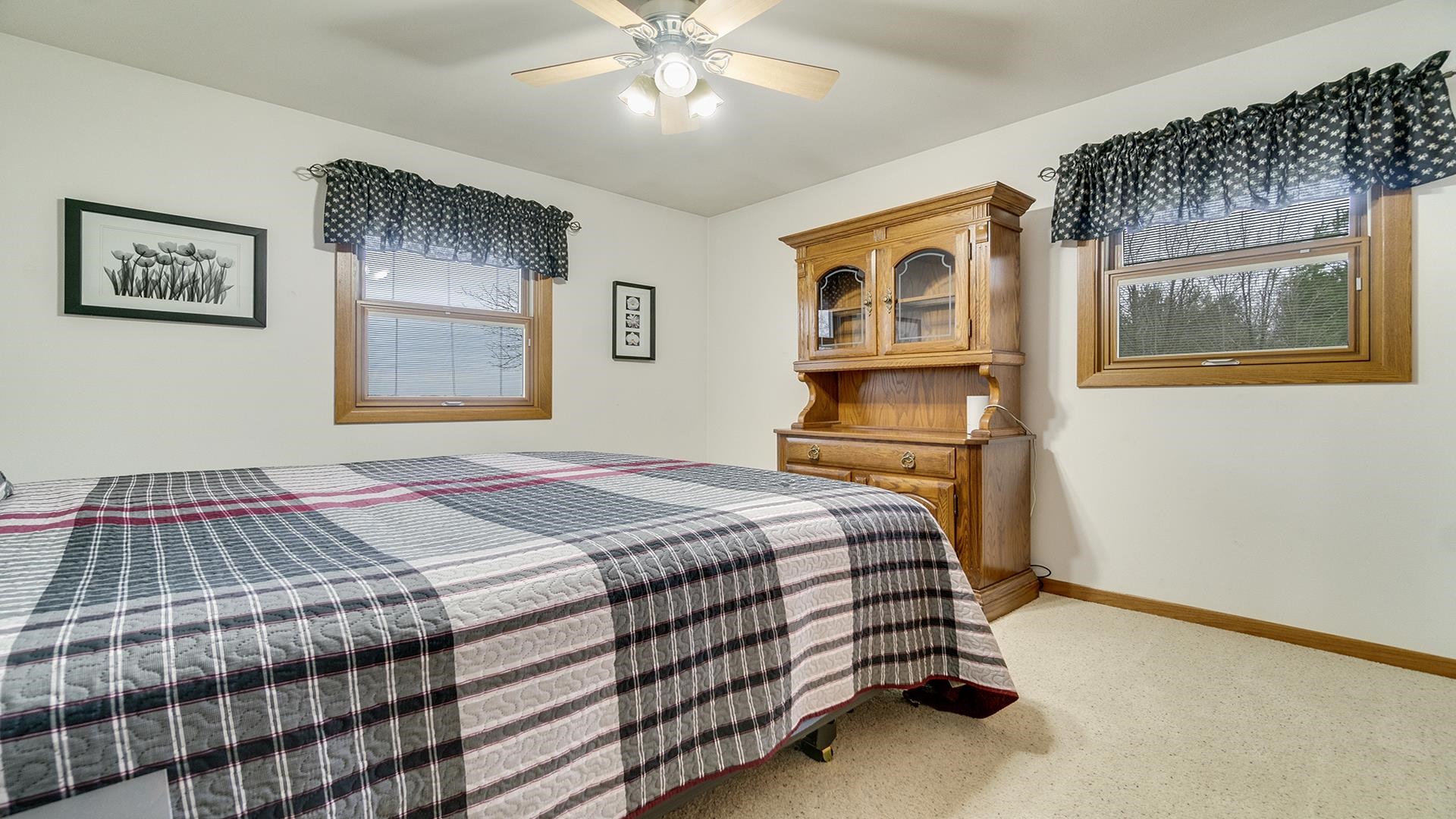 11764 North Tower Road Byron, IL 61010 - Photo 18 of 38 a bedroom with a bed and a chandelier
