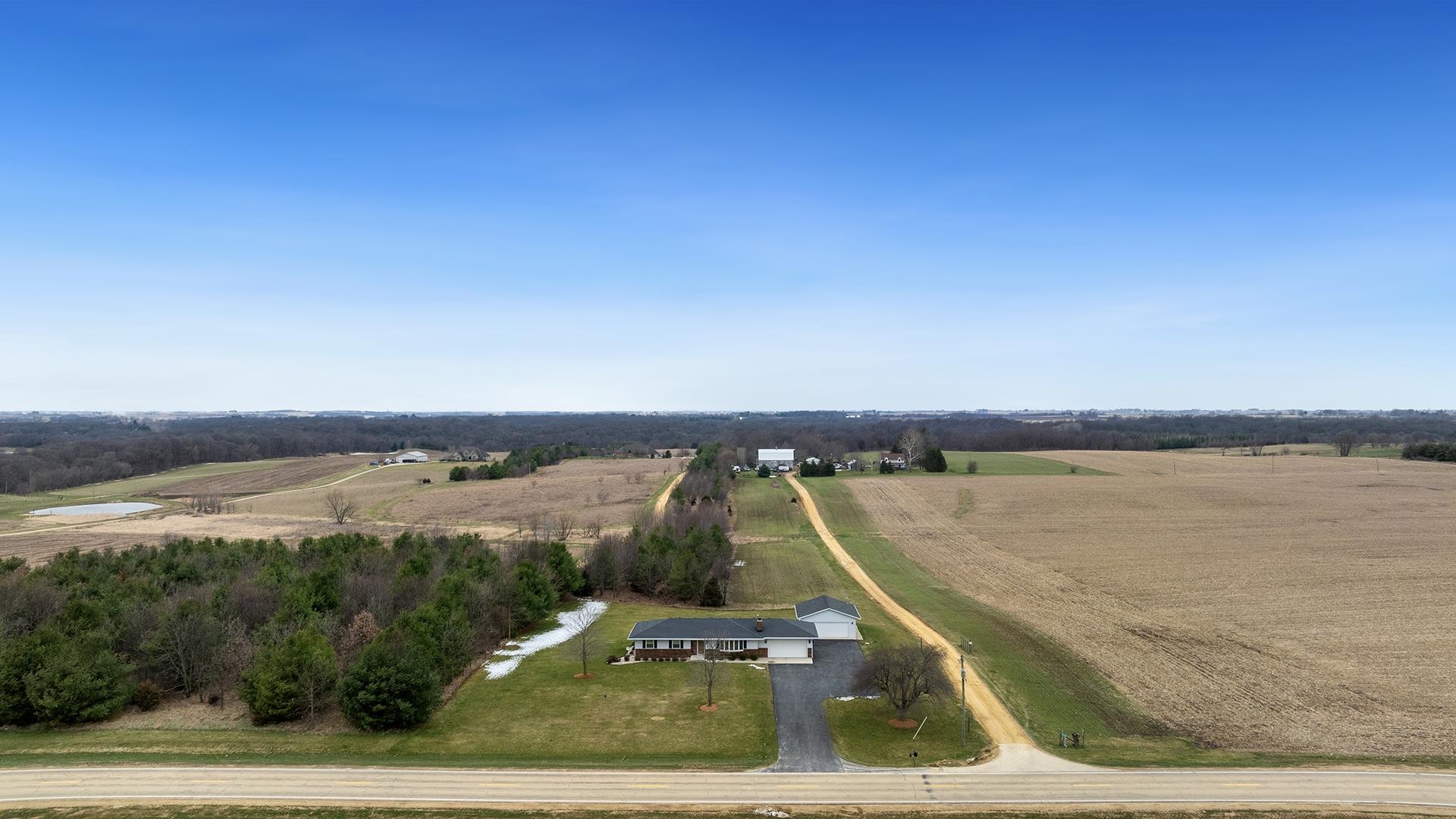 11764 North Tower Road Byron, IL 61010 - Photo 2 of 38 a view of a swimming pool and lake view