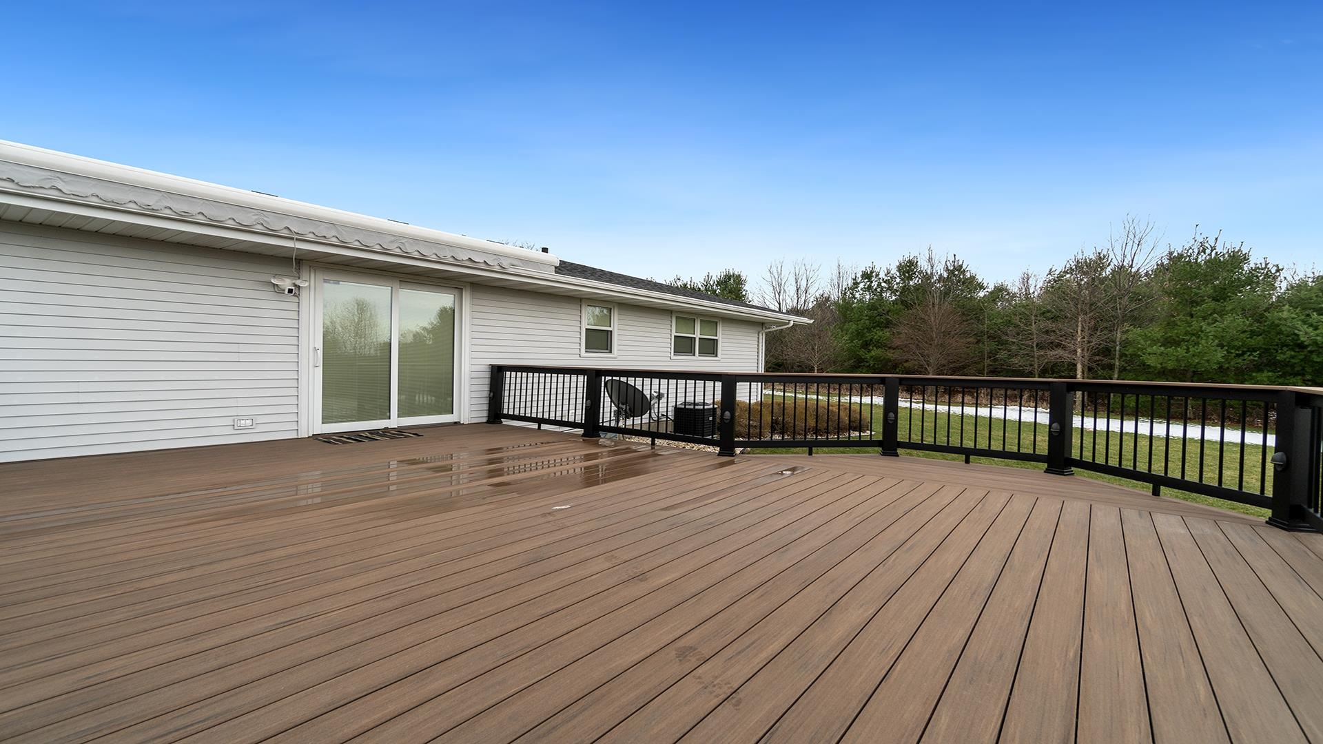 11764 North Tower Road Byron, IL 61010 - Photo 30 of 38 a view of a house with wooden deck
