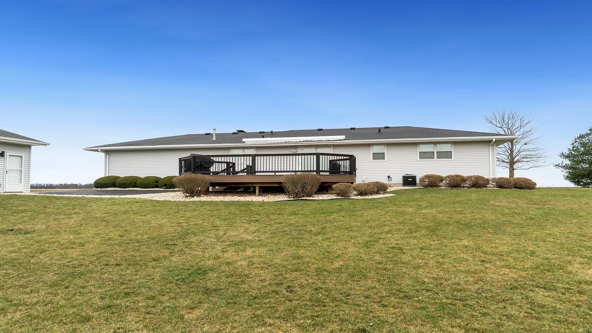 11764 North Tower Road Byron, IL 61010 - Photo 33 of 38 a front view of a house with a garden