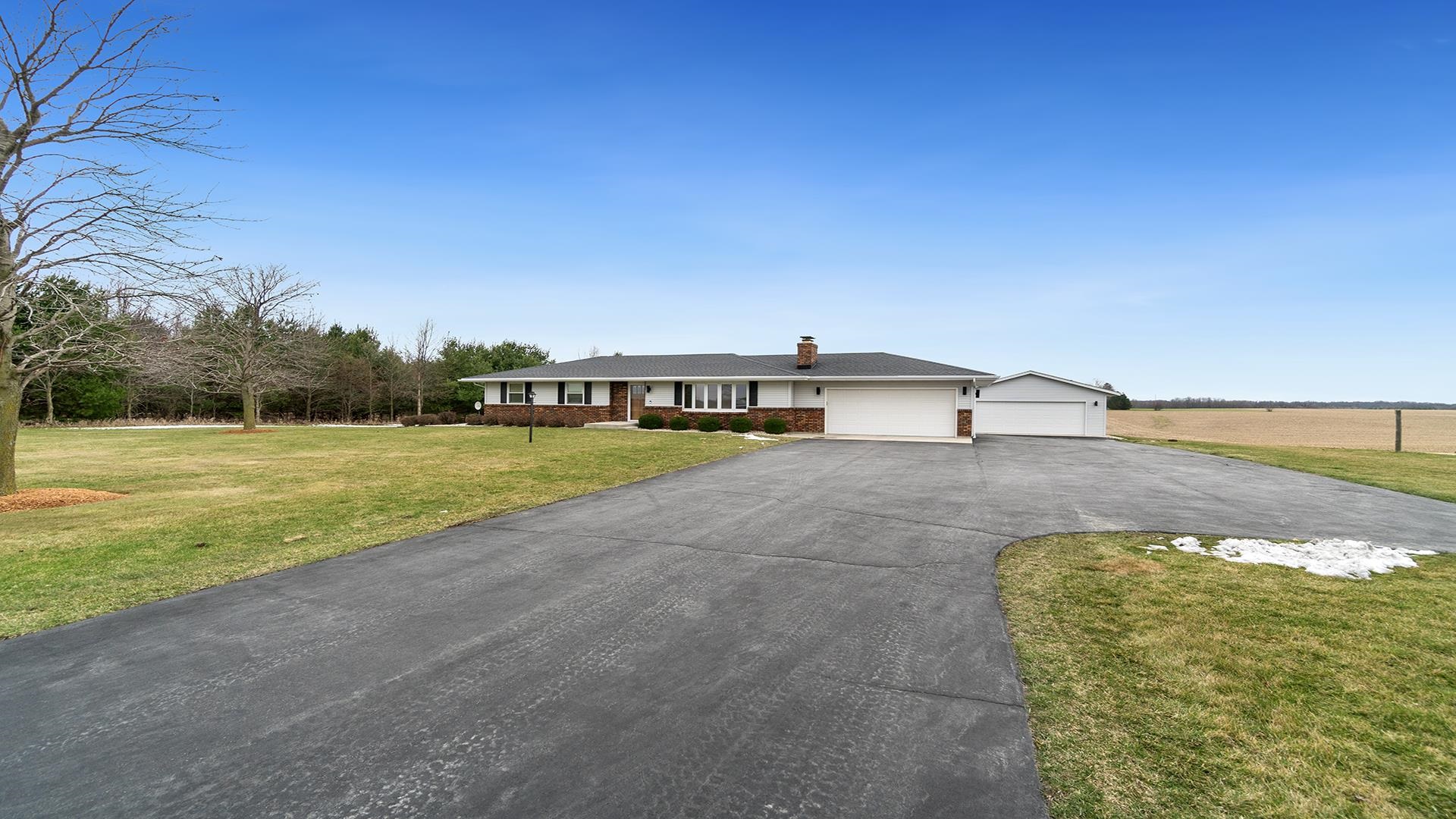 11764 North Tower Road Byron, IL 61010 - Photo 34 of 38 a view of a swimming pool with an outdoor seating and a yard