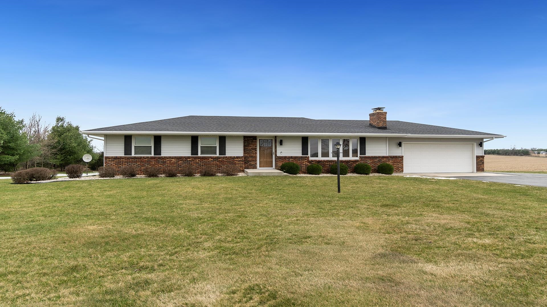 11764 North Tower Road Byron, IL 61010 - Photo 36 of 38 a house view with a garden space