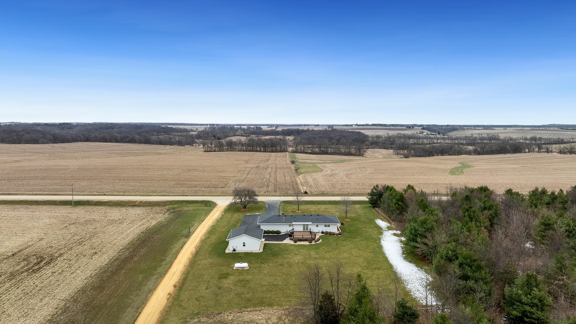 11764 North Tower Road Byron, IL 61010 - Photo 37 of 38 a view of a lake with houses in the back