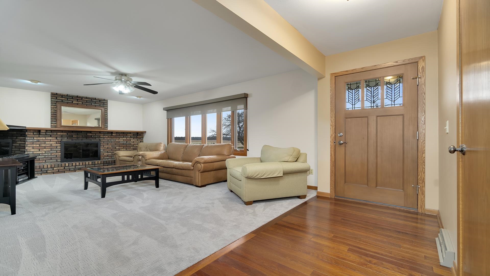 11764 North Tower Road Byron, IL 61010 - Photo 5 of 38 a living room with furniture and a wooden floor