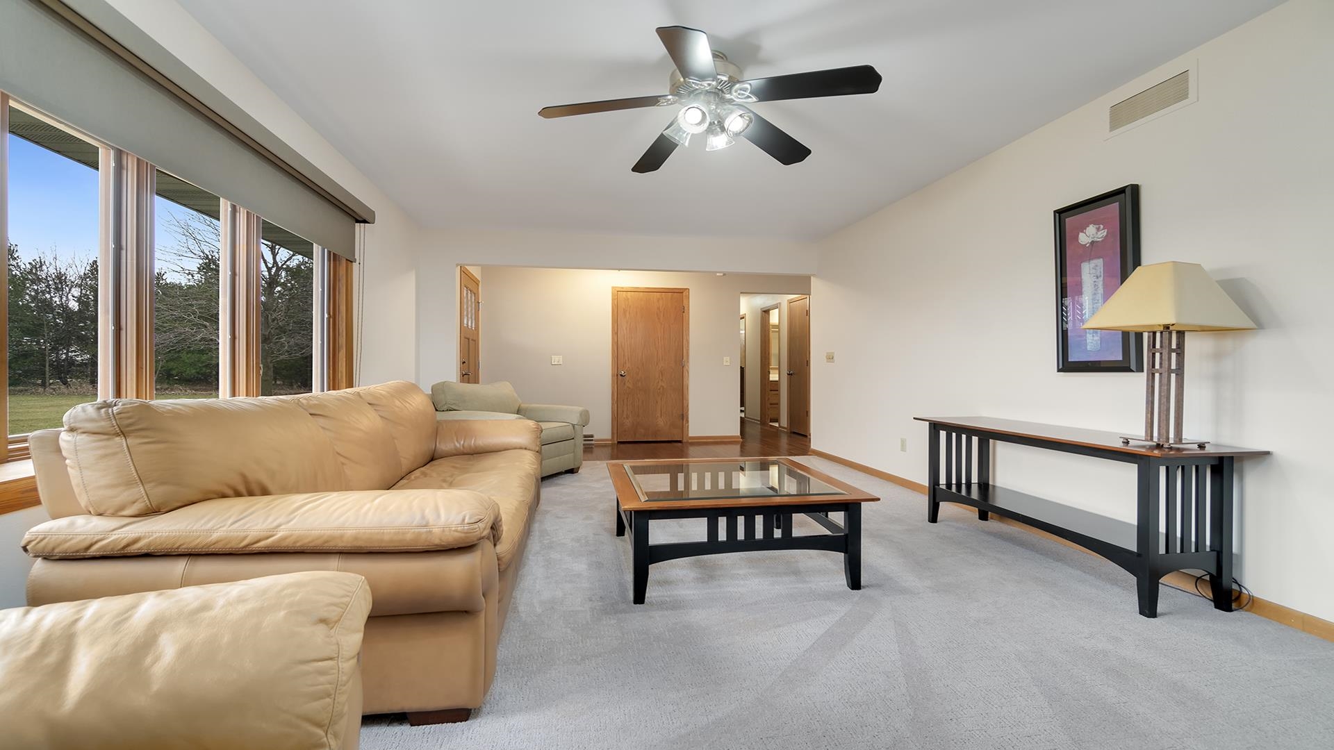 11764 North Tower Road Byron, IL 61010 - Photo 7 of 38 a living room with furniture and a ceiling fan