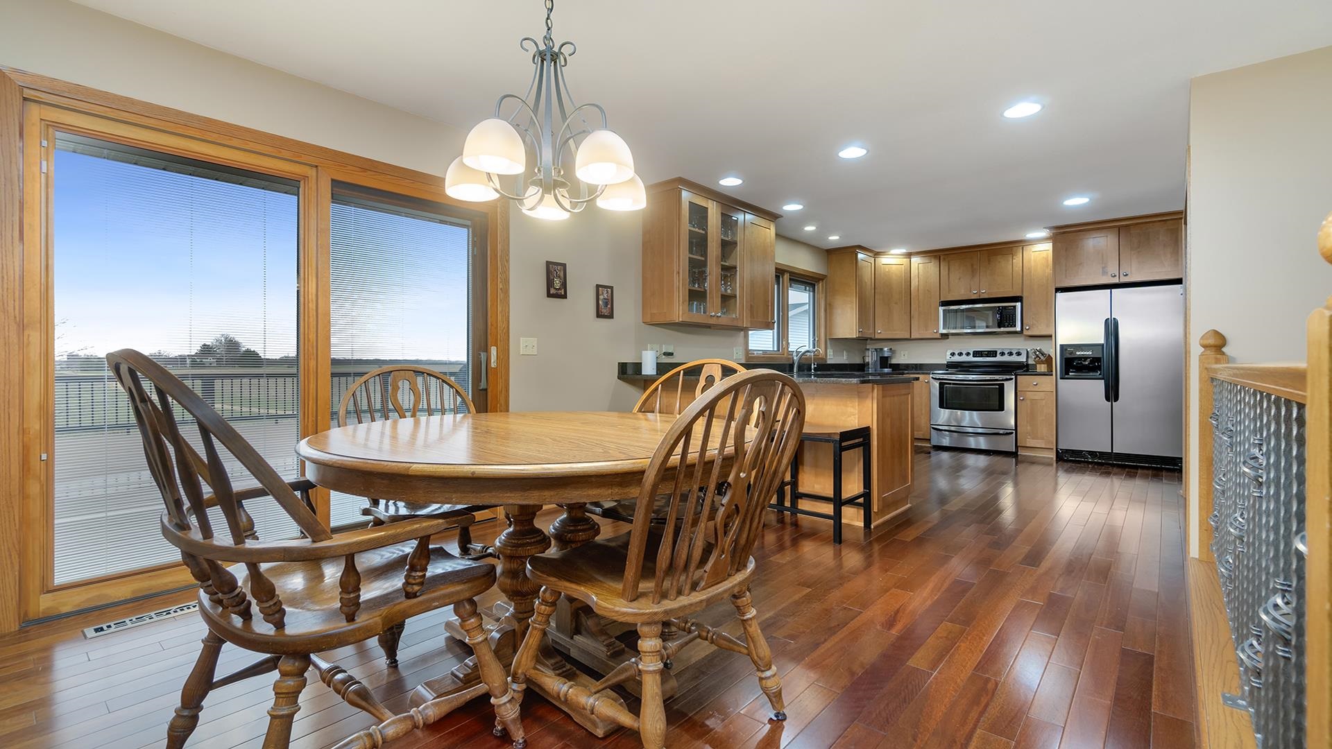 11764 North Tower Road Byron, IL 61010 - Photo 8 of 38 a view of a dining room with furniture and wooden floor