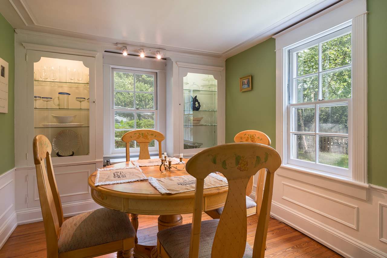 525 Valley Road Charlottesville, VA 22903 - Photo 4 of 14 a dining room with furniture a chandelier and wooden floor