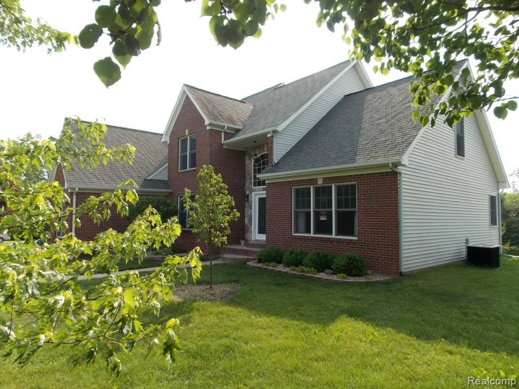 2974 Hannan Road Imlay City, MI 48444 - Photo 1 of 45 Brick face with Stone facade highlights this hilltop home