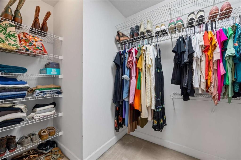 750 Staghorn Trail Nicholson, GA 30565 - Photo 24 of 55 a view of walk in closet with clothes and shoes