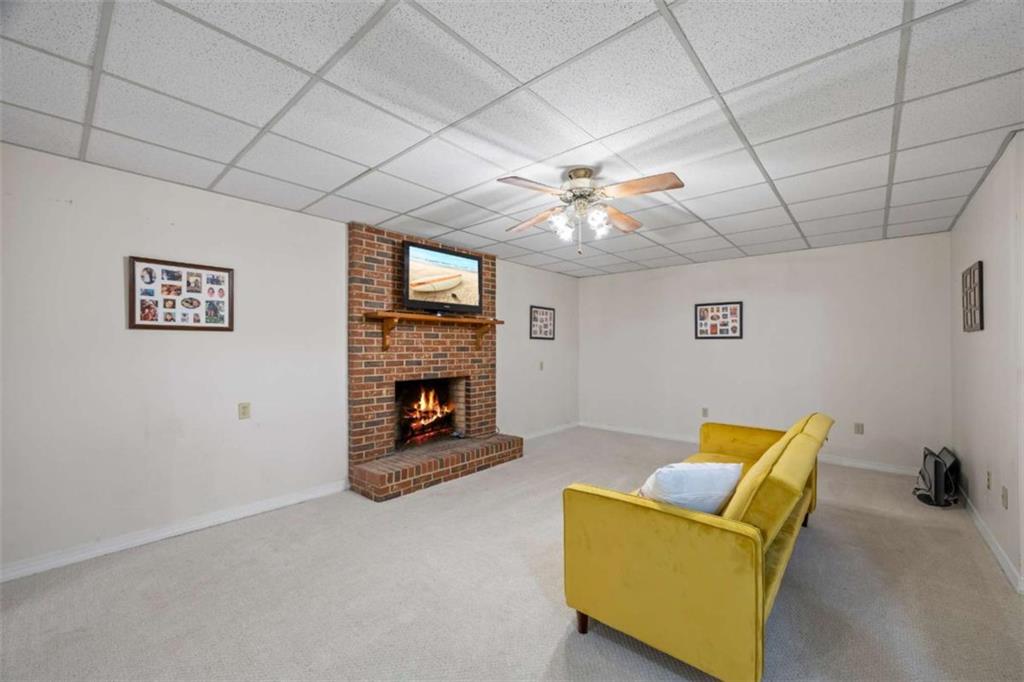 750 Staghorn Trail Nicholson, GA 30565 - Photo 29 of 55 a living room with furniture and a fireplace