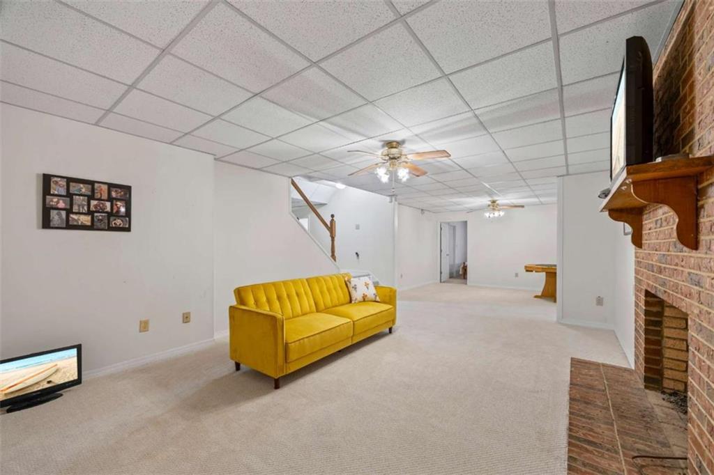 750 Staghorn Trail Nicholson, GA 30565 - Photo 30 of 55 a living room with furniture and a flat screen tv