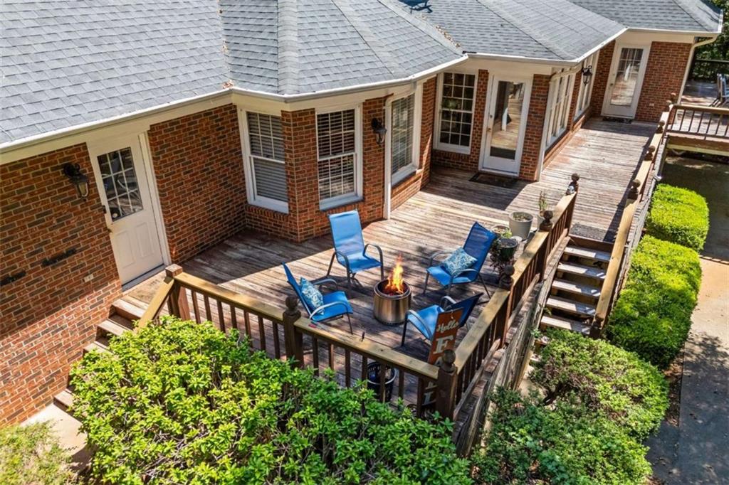 750 Staghorn Trail Nicholson, GA 30565 - Photo 36 of 55 front view of a house with a chairs and table in the patio
