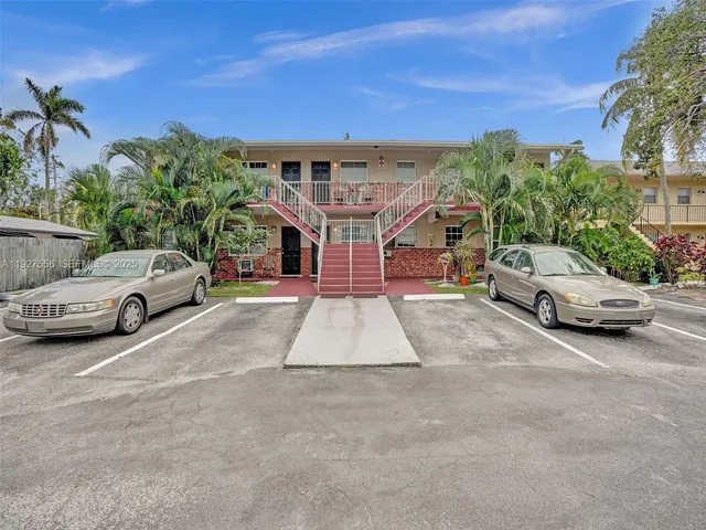 a view of a car parked in front of a house