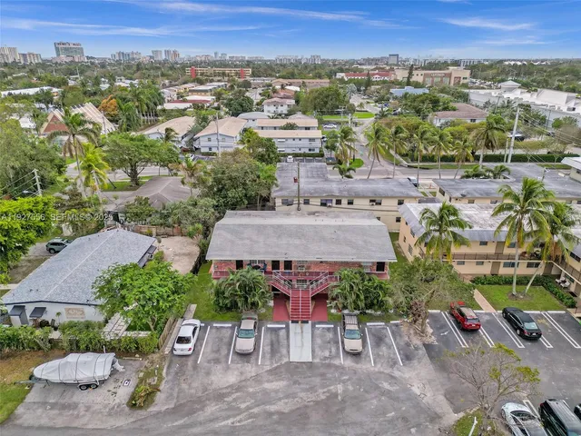 a view of a livingroom with a ceiling fan and window