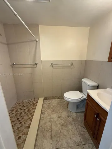 an empty room with a empty space and windows