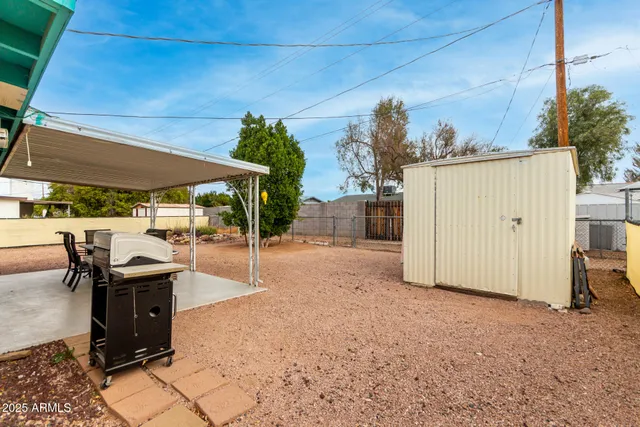 a view of a backyard with sitting area