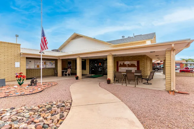 a front view of a house with sitting area and chandelier