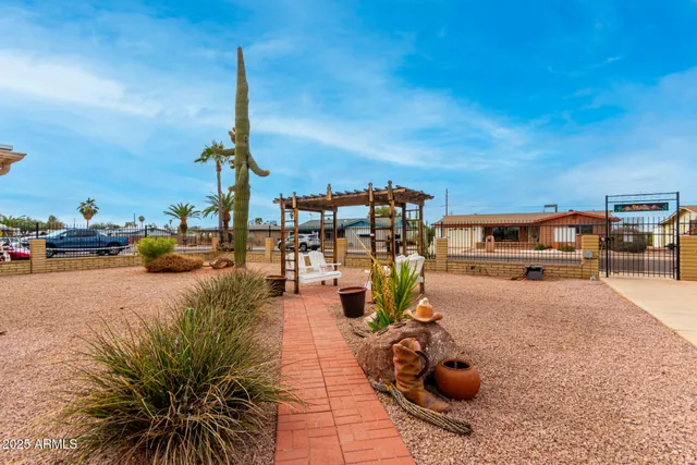 a view of a swimming pool with furniture