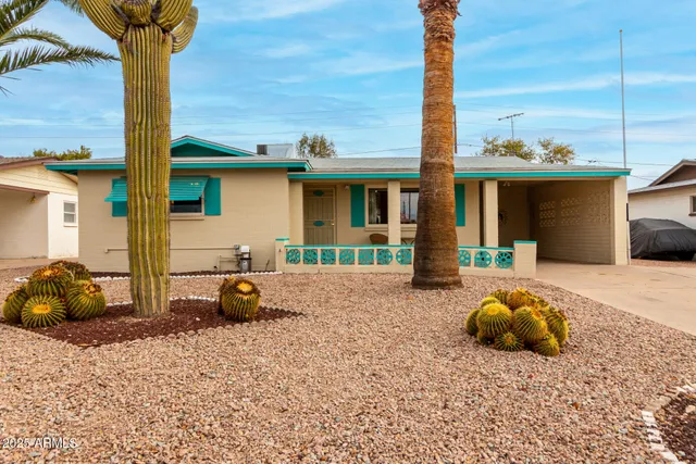 a front view of a house with backyard space and seating