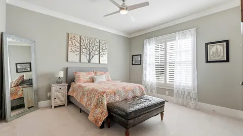 a bathroom with a granite countertop sink a toilet and shower