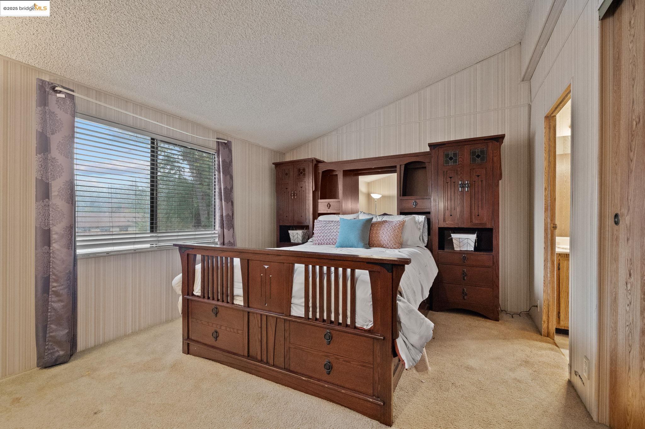 18717 Mill Villa Road, Unit 340 Jamestown, CA 95327 - Photo 13 of 21 a bedroom with furniture and windows
