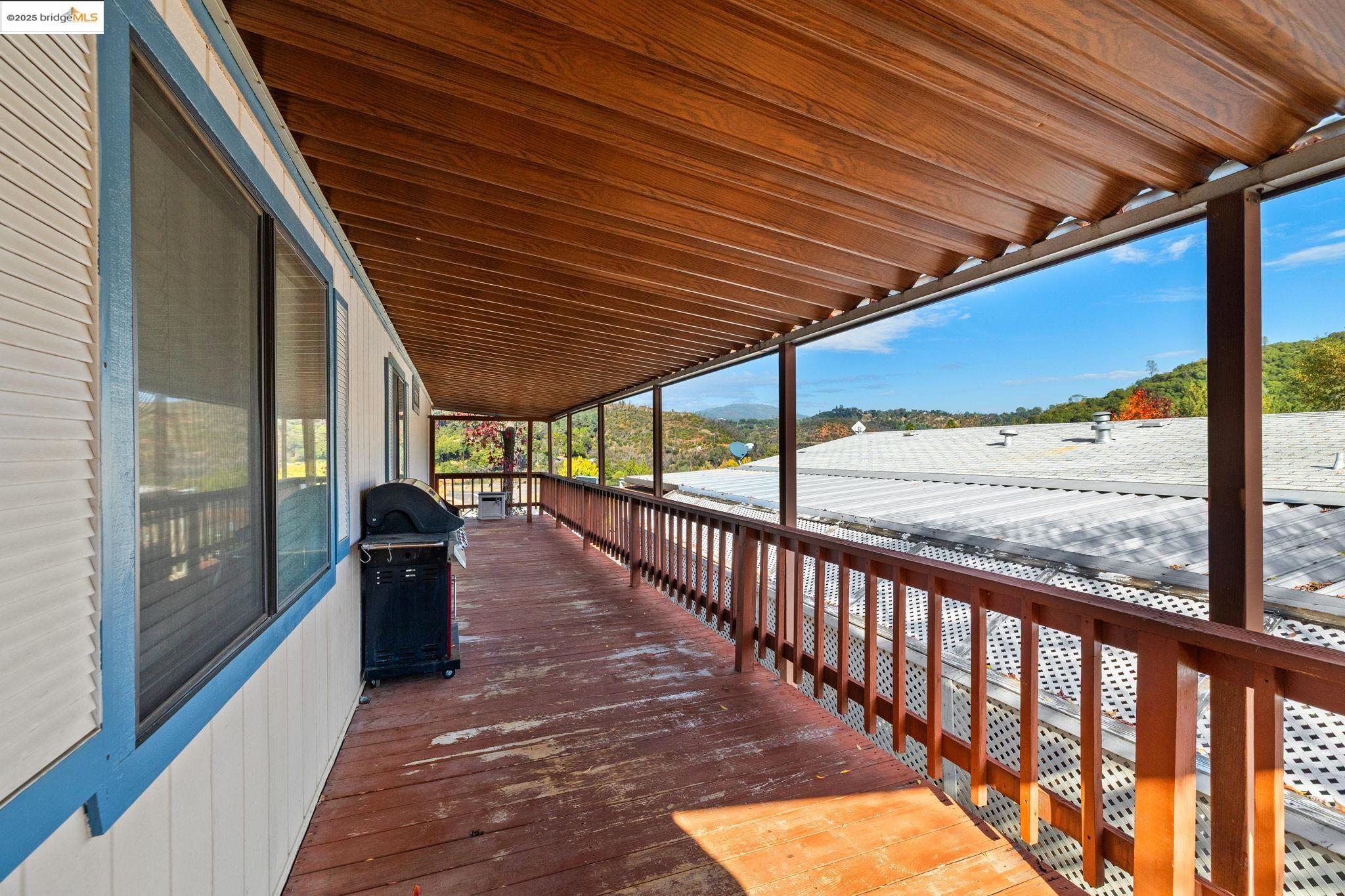 18717 Mill Villa Road, Unit 340 Jamestown, CA 95327 - Photo 21 of 21 a view of porch with wooden floor and outdoor seating