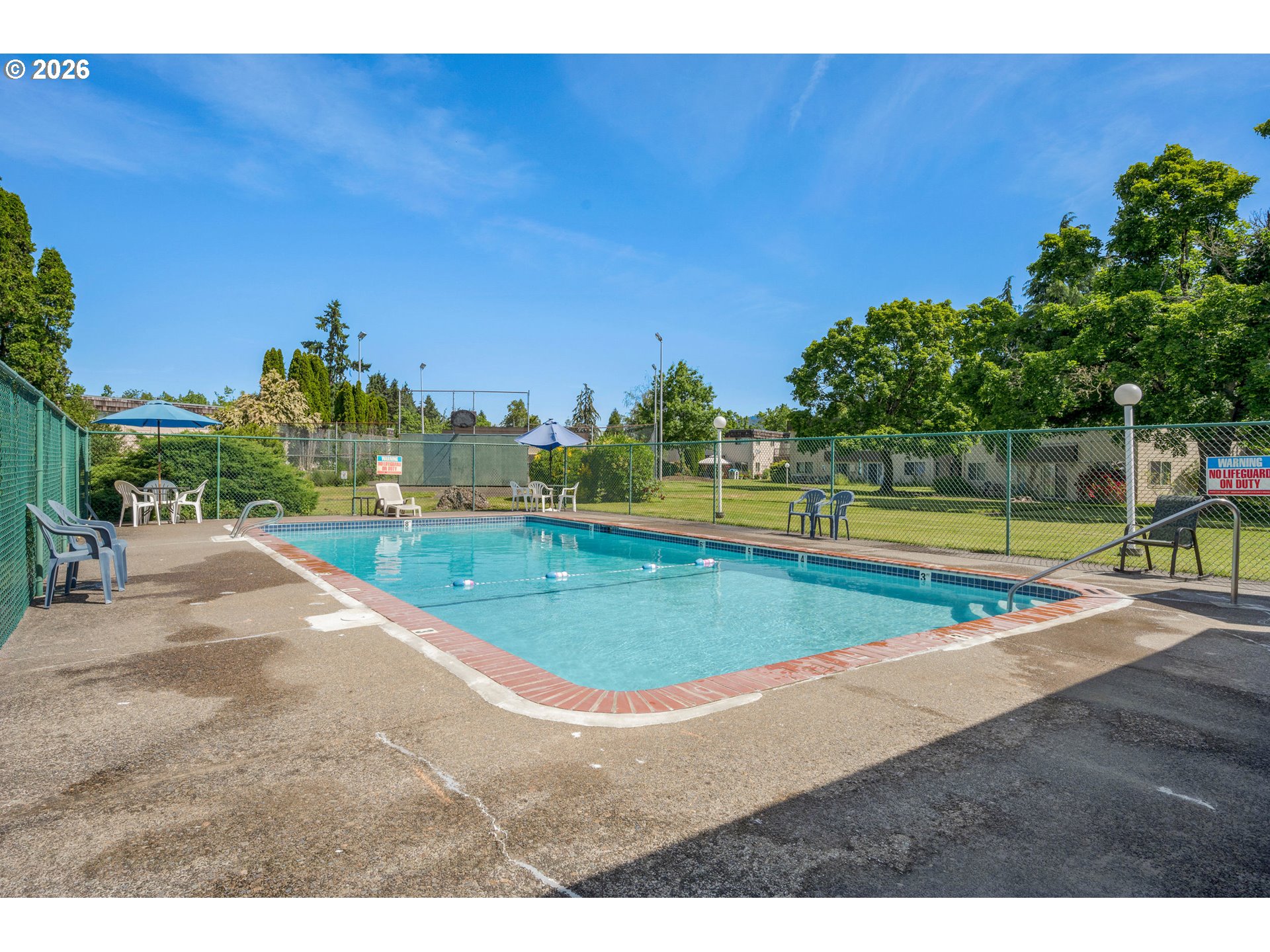 2727 Gateway Street, Unit 18 Springfield, OR 97477 - Photo 29 of 34 a view of a swimming pool with an outdoor space and seating area