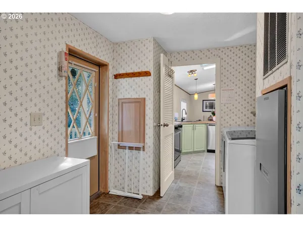 a kitchen that has a sink and a stove in it