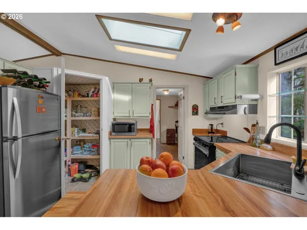 a kitchen with a sink and a window