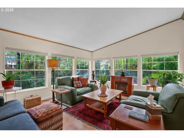 a living room with furniture and a lamp