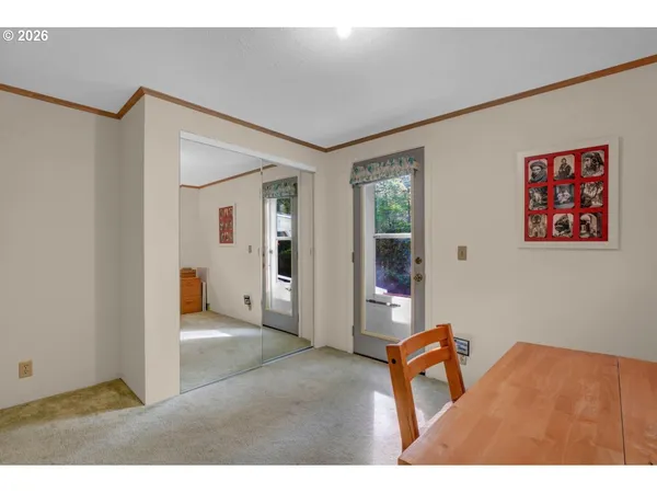 a bathroom with a sink a toilet a mirror and shower