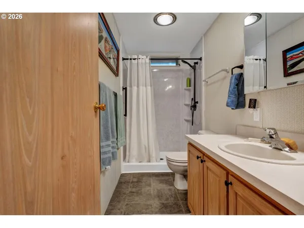 a bathroom with a sink vanity and a mirror
