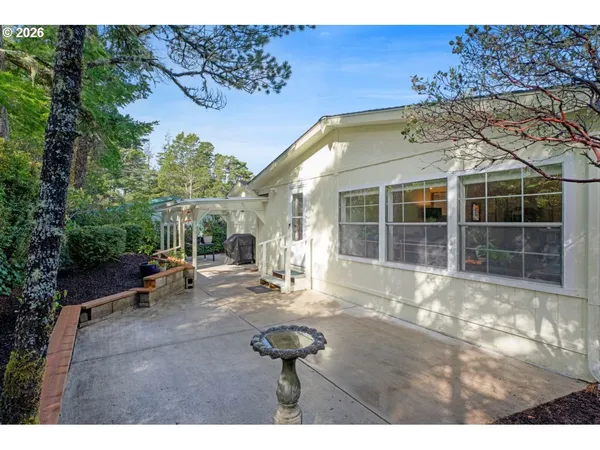 a view of a chairs and table in the patio