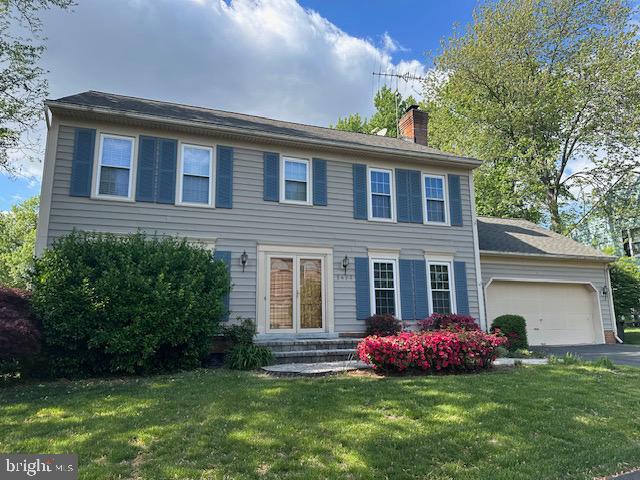 5423 Rilian Court Burke, VA 22015 - Photo 2 of 67 a front view of a house with a garden and yard