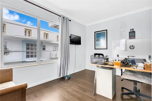 a workspace with furniture and wooden floor